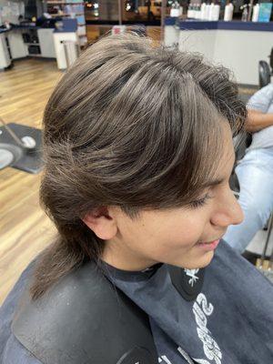 Hair, grown out taper mullet, with soft layers through top and sides, for a softer look.