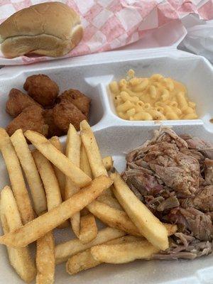 Pulled Pork plate with Fries, macaroni and cheese, and Fried Sweet Corn Nuggets.  Get the sweet corn nuggets!!  So good and unique.