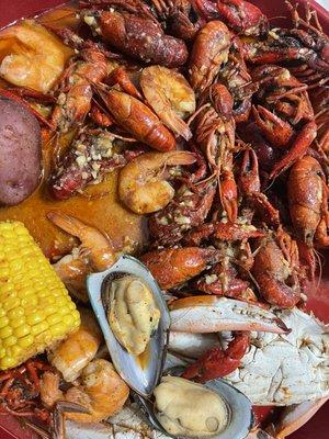 Seafood Combo 1, 1 lb. Blue Crab,1 lb. Live Boil Crawfish.  Already ate some