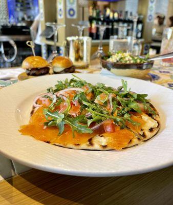 Smoked Salmon Focaccia ($8) arugula, capers, tomatoes, hummus