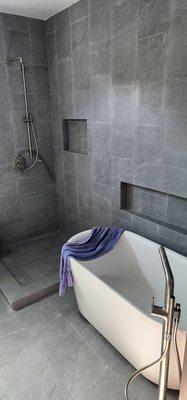 Shower with stand alone soak tub.