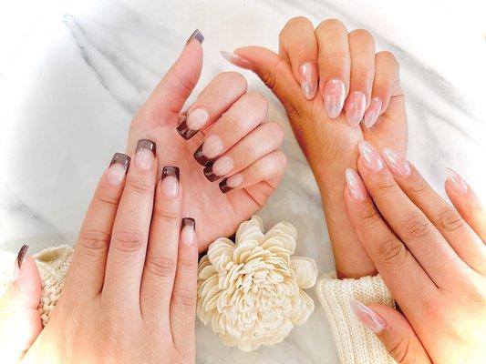 Dark brown French tip and pearly white chrome nails