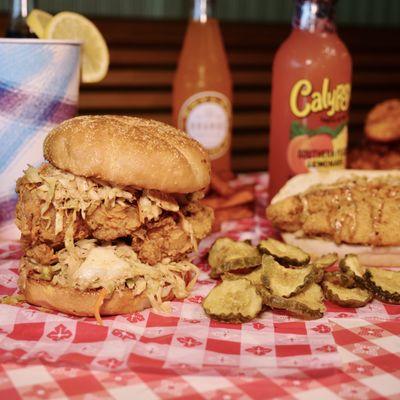 Perfectly fried Southern delicacies: crispy fried chicken sandwich and mouthwatering fried catfish.