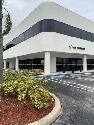 Side view of MCD Pharmacy- shows ample parking throughout the day.