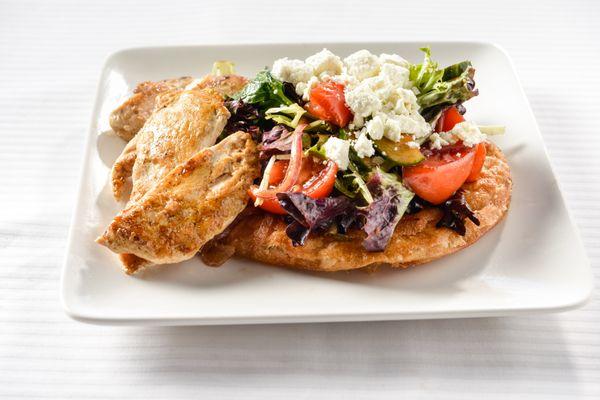 Spring mix, tzatziki, shaved red onion, feta, marinated cucumber and tomato salad, crispy fried flat bread