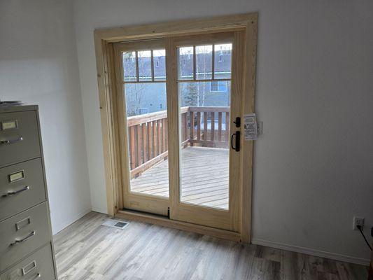 Pine trim French patio doors and black hardware.