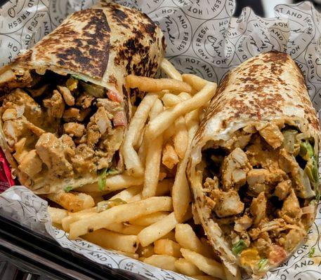 Chicken shawarma wrap on a bed of fries. DELICIOUS!