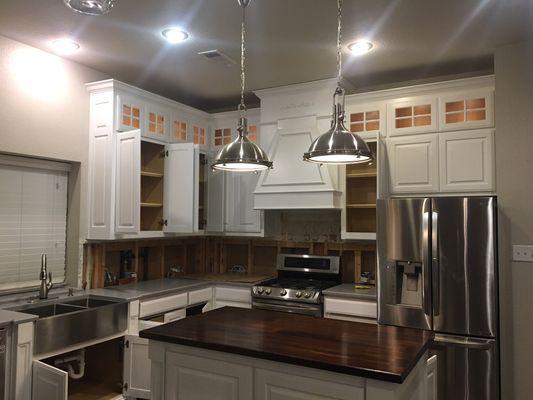 This is a kitchen remodel we updated with undercounter LED lighting, custom cabinet lighting & hanging lights