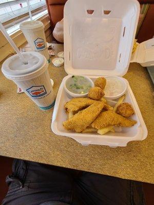 Catfish Feast with fries hush puppies broccoli and coleslaw.