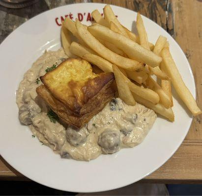 Bouchées à la Reine (Chicken Vol au Vent) Chicken, Veal Meatballs, Mushrooms, Puff Pastry.  Served with Belgian Frites