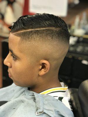 Medium skin fade with a comb over