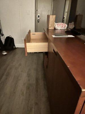 Dresser door comes out because the uneven flooring