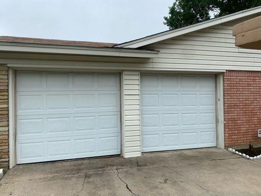 Before photo. We removed the Center Post and Installed a single garage door!