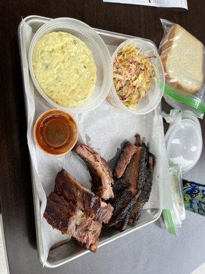 Two meat plate: ribs + brisket.  Sides: potato salad + coleslaw.