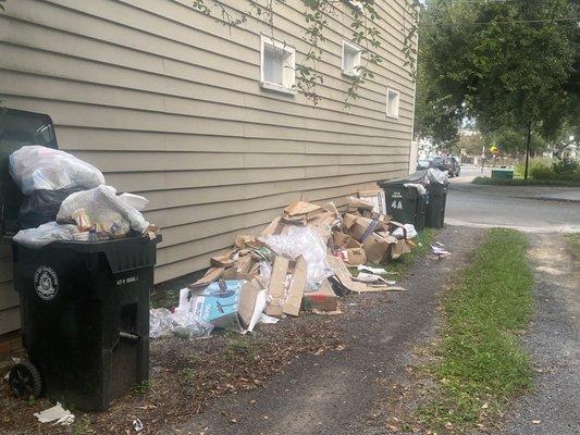 Trash in driveway new renters of slowly building up.