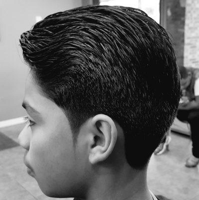 Regular haircut with pointed sideburns