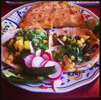 Cheese quesadilla, one chicken and one steak taco.