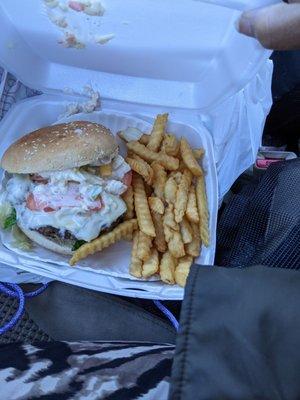 Slamming coleslaw lettuces, tomato and onion burger