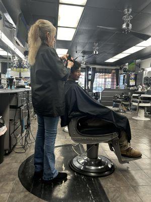 My fiancé getting his hair cut