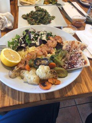 Zataran shrimp bowl with veggies rice and side of kale quinoa tabouleh in the background