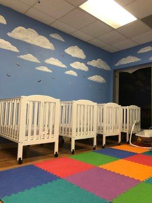 Our Infant room contains labeled baby cribs and cubbies, toys that promote motor skills, and ALOT of foam mates! Shoes off please!