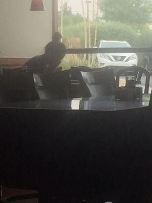 One waitress doing all the work and she sits there