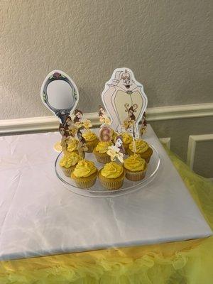 Cupcakes by Sugarfoot's.  I purchased the belle topper and placed it myself after delivered.