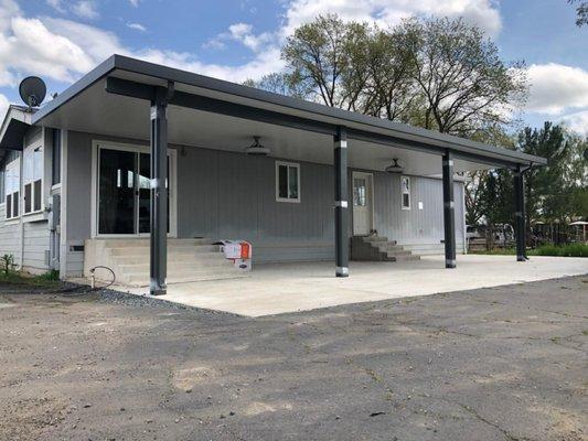 Attached insulated roof patio cover. Equipped with 2 fans and can lights.