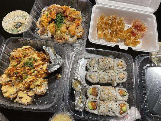 Top left clockwise: 8 Piece Matsu Roll, 6 Piece Crab Cheese Puff, Scallop Roll, Salmon Roll, 8 Piece Volcano Roll