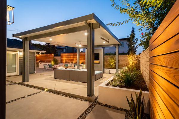 Complete outdoor renovation with aluminum patio cover and entertainment wall