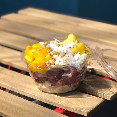 Tropical Açaí Bowl (mango, pineapple and banana topped with granola, pumpkin seeds, shaved coconut and honey)