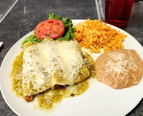 Beef and chicken enchiladas with green salsa, refried been, and Mexican rice.