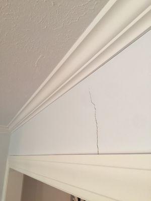 Opened a wall and did not put in support, leaving ceiling to crack and bow