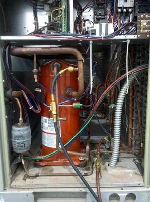 The inner workings of a commercial heat pump package unit.