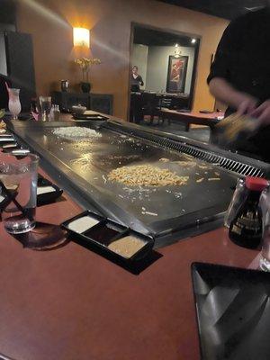 Chef preparing noodles and fried rice