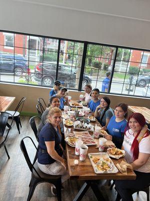 Meet the Top Shelf Team! We are taking some time off to enjoy lunch together in this photo