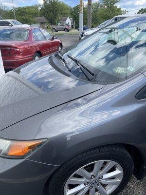 Two dents on the top of quarter panel.