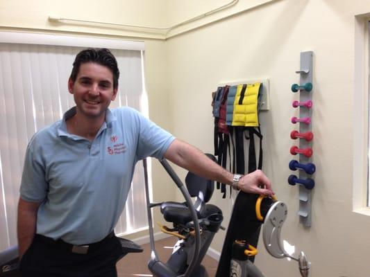 Dr. Steve Mikita, physical therapist in his therapeutic exercise area.