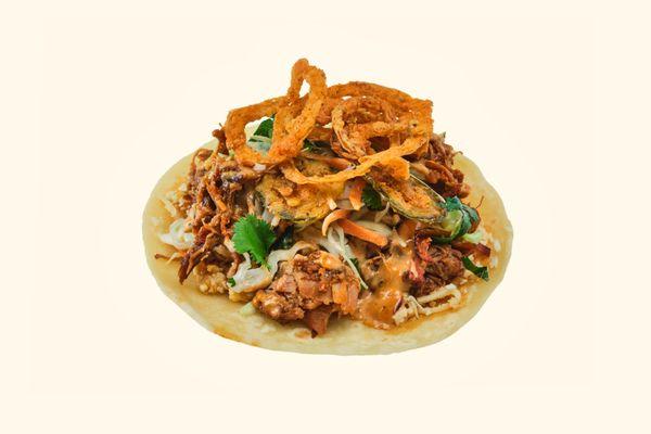 Pulled Pork Taco
mesquite smoked pulled pork, mexican cheese, fried onions, chipotle mayo, cilantro coleslaw, crispy jalapeños, bbq sauce