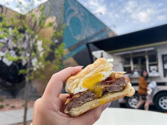 Sausage bacon, breakfast sandwich on a biscuit with a fried egg