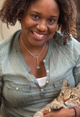 Dr. Araba connecting with her feline friend