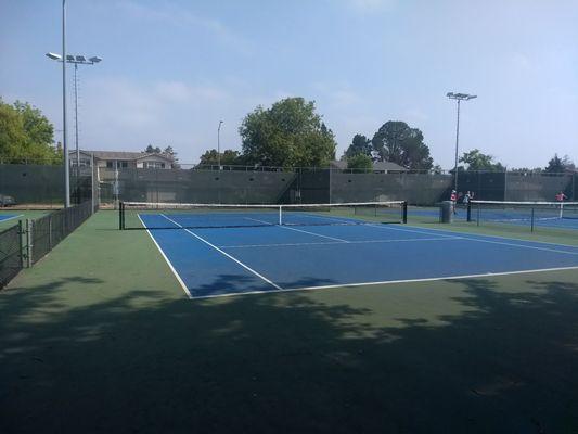 Ladies in far court are wearing masks while playing