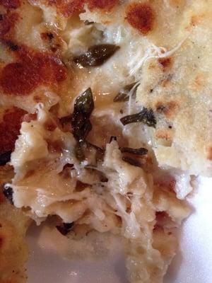 Close-up of the loroco in my pupusa