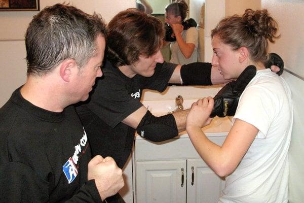 We use scenario training to pressure test our techniques. Here a student is facing two attackers  in a bathroom