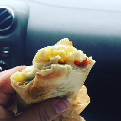 Veggie breakfast wrap. It has egg, pepper jack cheese, and red bell peppers.