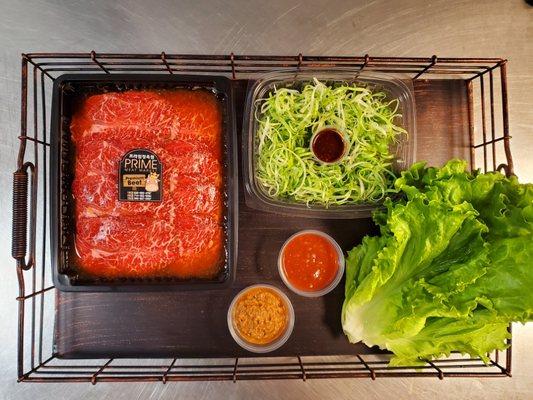 With $30 or more BBQ meat purchase, you'll receive freshly washed lettuce, green onion salad, house special ssamjang and hot sauce.