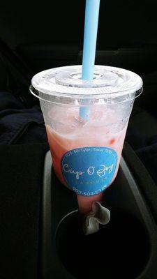 Rose flavored green tea milk tea iced with strawberry popping Boba. Very floral and delicious.