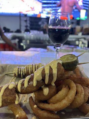 Cajun sausage skewers. It was OK but only three little pieces of sausage and lots of fried taters (over onion rings).