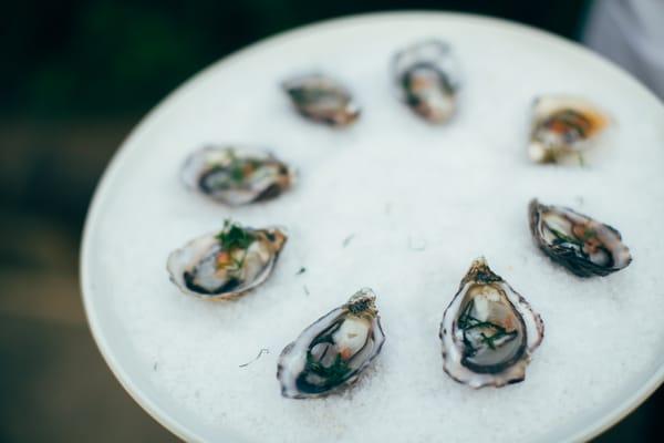 Kumamoto on the half shell with prosecco mignonette and micro shiso