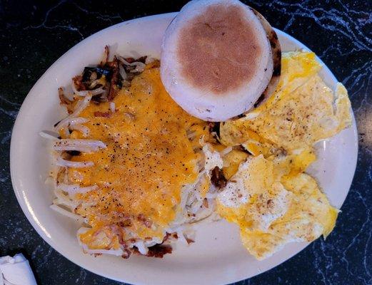 Scrambled eggs, cheesy hash browns, & English muffin